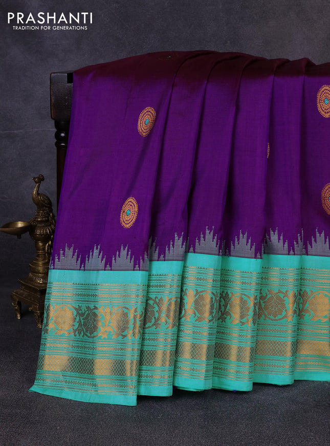 Pure gadwal silk saree purple and teal blue with allover zari woven buttas and temple design zari woven border