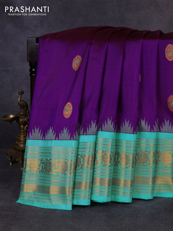 Pure gadwal silk saree purple and teal blue with allover zari woven buttas and temple design zari woven border