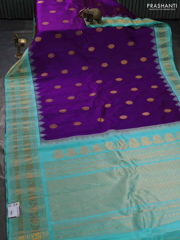 Pure gadwal silk saree purple and teal blue with allover zari woven buttas and temple design zari woven border
