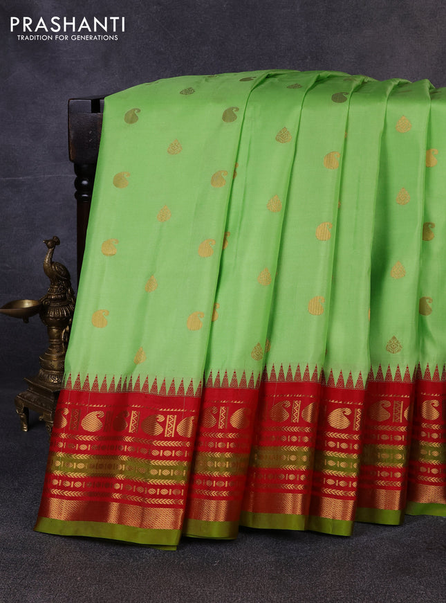 Pure gadwal silk saree pista green and red with allover zari woven buttas and temple design zari woven border