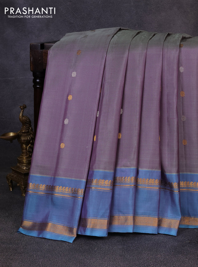 Pure gadwal silk saree dual shade of grey and blue shade with allover silver & zari woven buttas and rettapet zari woven border
