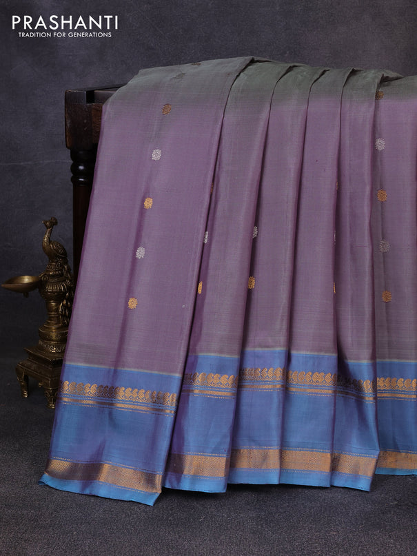 Pure gadwal silk saree dual shade of grey and blue shade with allover silver & zari woven buttas and rettapet zari woven border