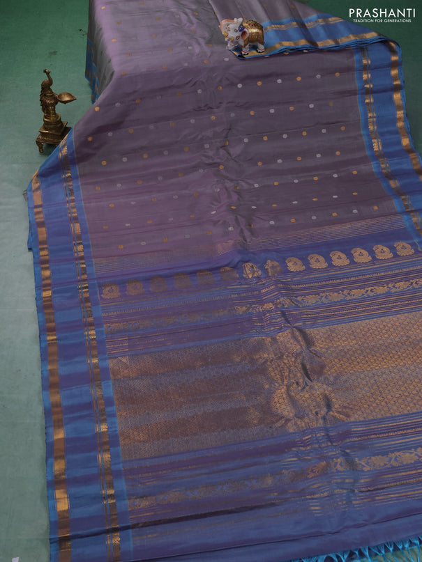 Pure gadwal silk saree dual shade of grey and blue shade with allover silver & zari woven buttas and rettapet zari woven border