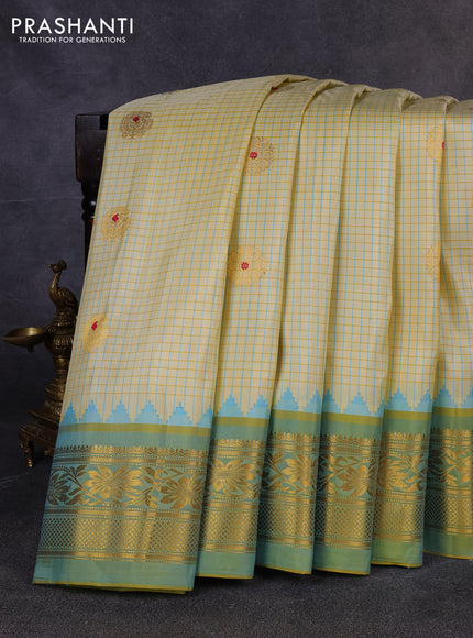 Pure gadwal silk saree cream and pista green with allover checks & zari woven buttas and temple design zari woven border
