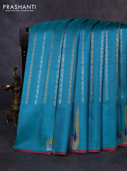 Pure gadwal silk saree teal green with allover silver & zari stripe pattern and peacock design zari woven butta border