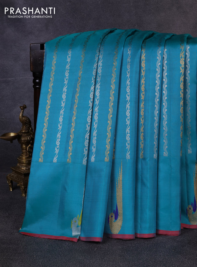 Pure gadwal silk saree teal green with allover silver & zari stripe pattern and peacock design zari woven butta border