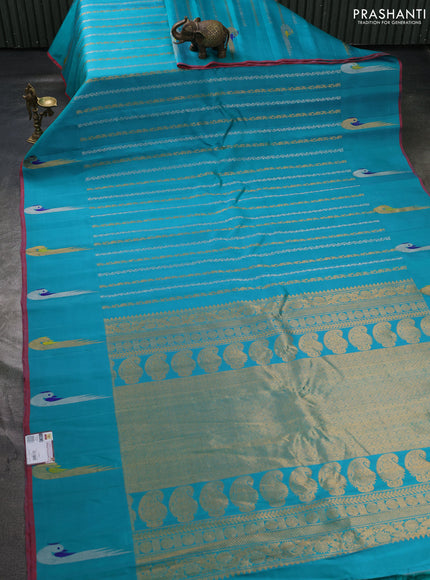 Pure gadwal silk saree teal green with allover silver & zari stripe pattern and peacock design zari woven butta border