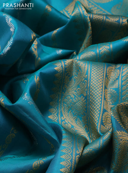 Pure gadwal silk saree teal green with allover silver & zari stripe pattern and peacock design zari woven butta border