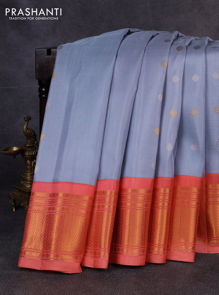 Pure gadwal silk saree bluish grey and peach orange with allover silver & zari woven buttas and zari woven korvai border