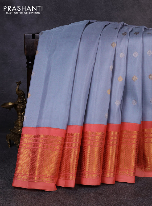 Pure gadwal silk saree bluish grey and peach orange with allover silver & zari woven buttas and zari woven korvai border