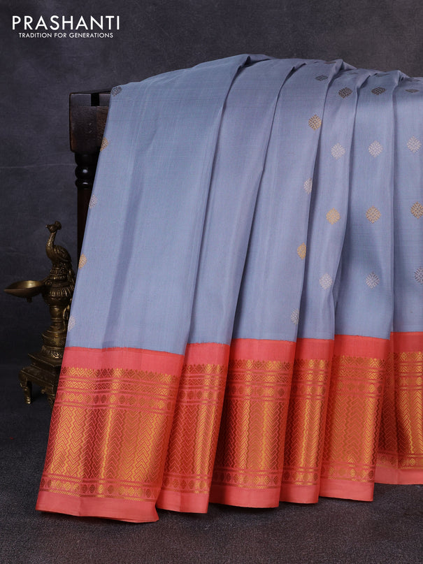 Pure gadwal silk saree bluish grey and peach orange with allover silver & zari woven buttas and zari woven korvai border
