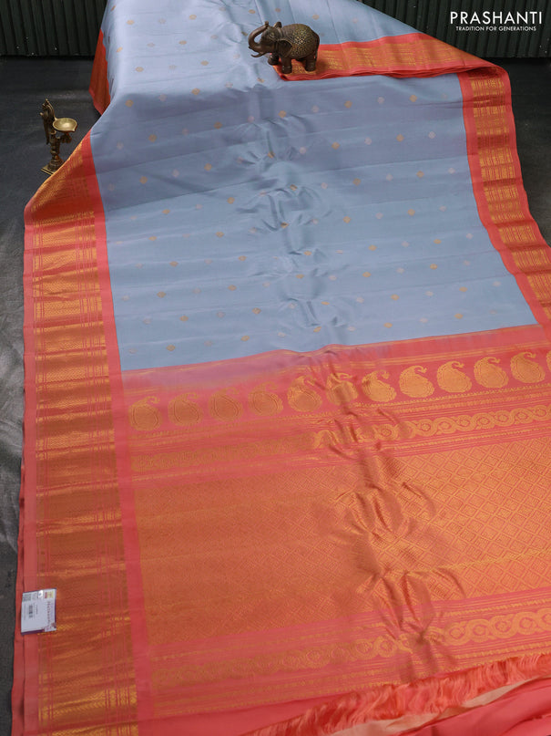 Pure gadwal silk saree bluish grey and peach orange with allover silver & zari woven buttas and zari woven korvai border