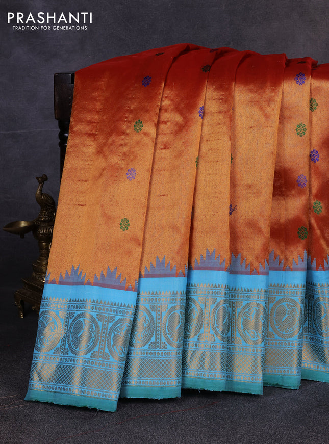 Pure gadwal tissue silk saree rust shade and teal blue with allover thread woven buttas and temple design zari woven border