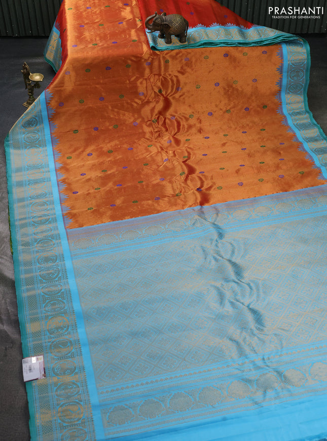 Pure gadwal tissue silk saree rust shade and teal blue with allover thread woven buttas and temple design zari woven border