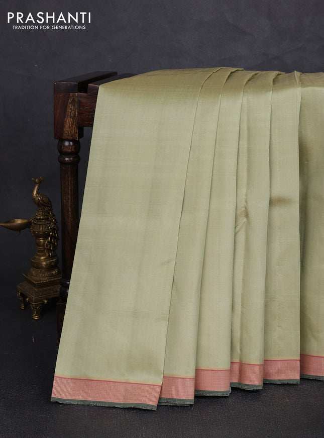 Pure kanchipuram silk saree pista green and red with plain body and thread woven border