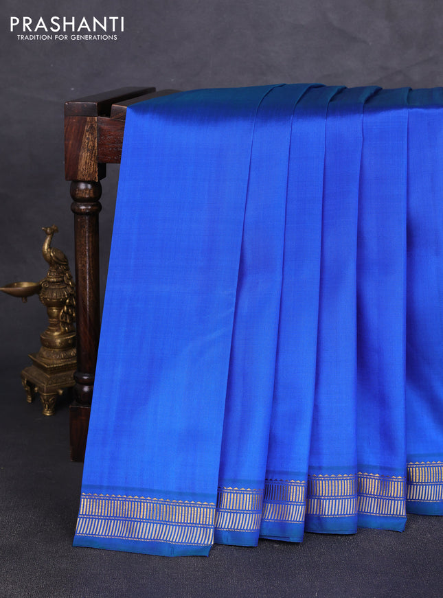 Pure kanchipuram silk saree blue and green shade with plain body and zari woven border