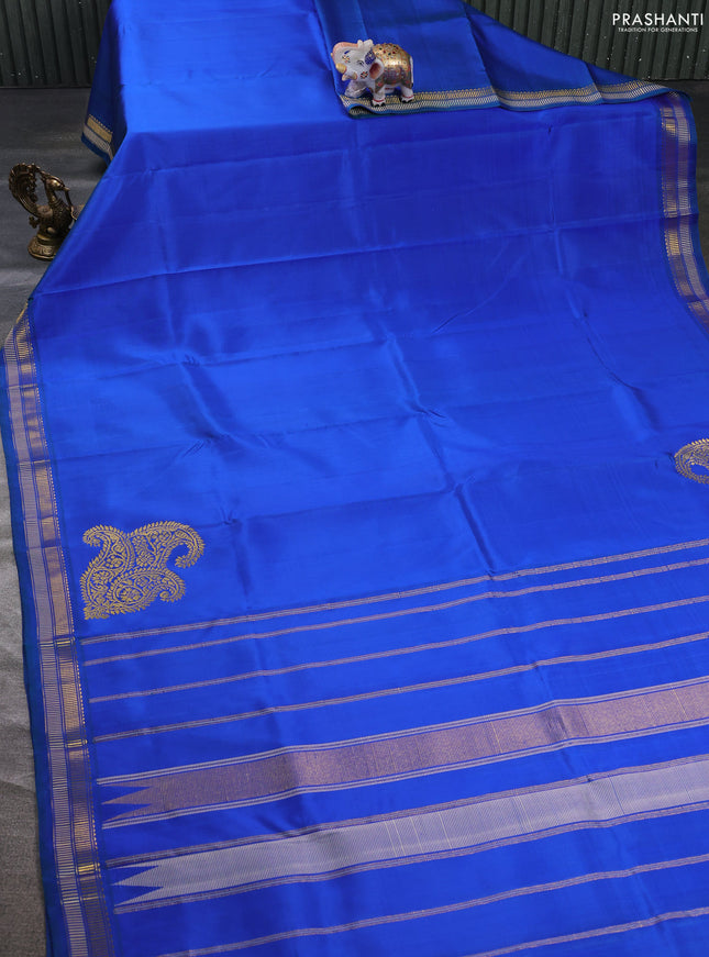 Pure kanchipuram silk saree blue and green shade with plain body and zari woven border