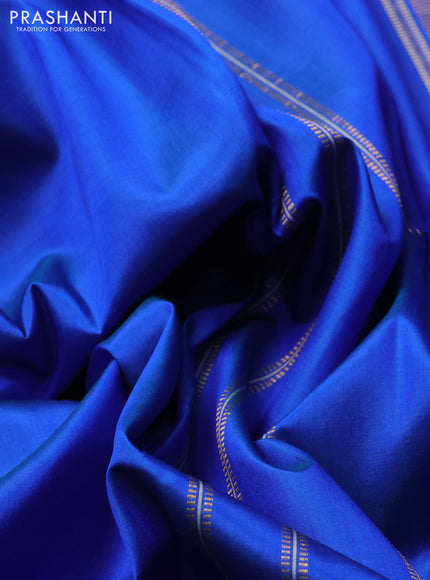 Pure kanchipuram silk saree blue and green shade with plain body and zari woven border
