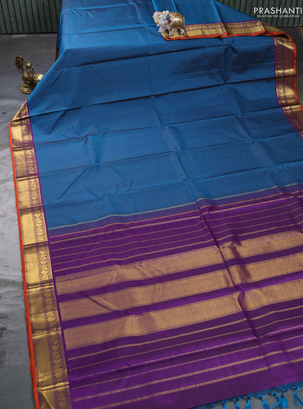 Pure kanchipuram silk saree peacock green and purple with plain body and zari woven border
