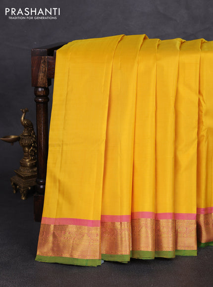 Pure kanchipuram silk saree yellow and pink shade with plain body and zari woven border
