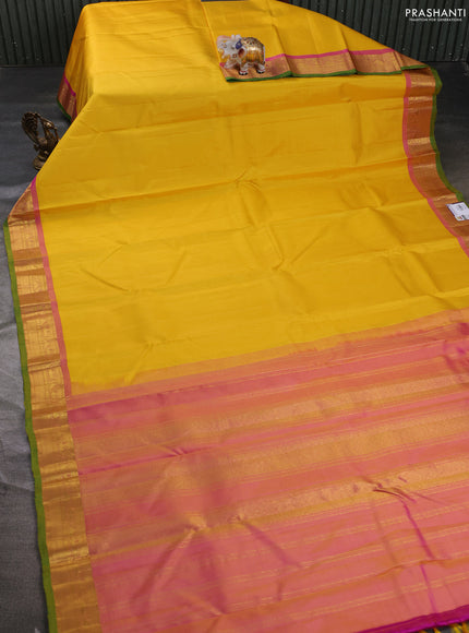 Pure kanchipuram silk saree yellow and pink shade with plain body and zari woven border