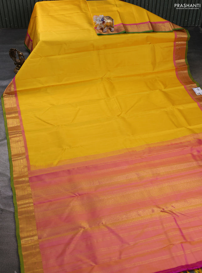 Pure kanchipuram silk saree yellow and pink shade with plain body and zari woven border
