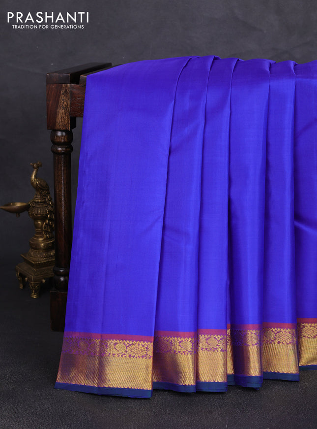 Pure kanchipuram silk saree royal blue and orange with plain body and zari woven border