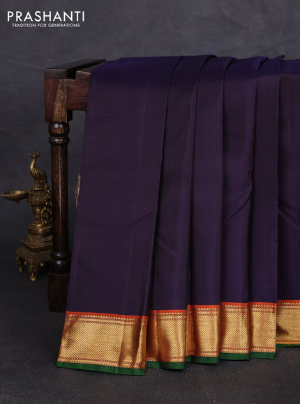 Pure kanchipuram silk saree jamun shade and orange with plain body and zari woven border