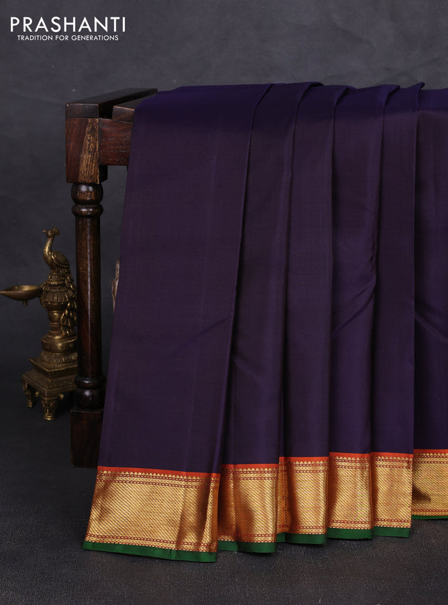 Pure kanchipuram silk saree jamun shade and orange with plain body and zari woven border