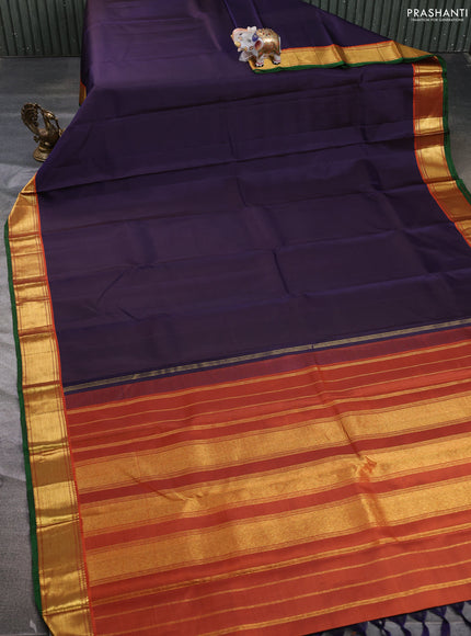 Pure kanchipuram silk saree jamun shade and orange with plain body and zari woven border