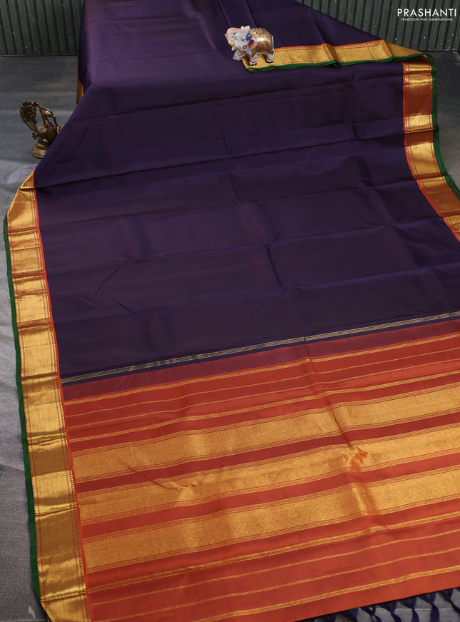 Pure kanchipuram silk saree jamun shade and orange with plain body and zari woven border