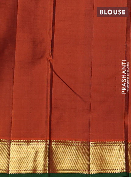 Pure kanchipuram silk saree jamun shade and orange with plain body and zari woven border