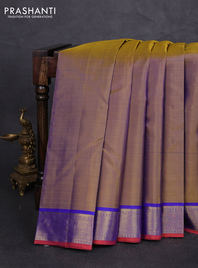 Pure kanchipuram silk saree dual shade of mustard and royal blue with plain body and zari woven border