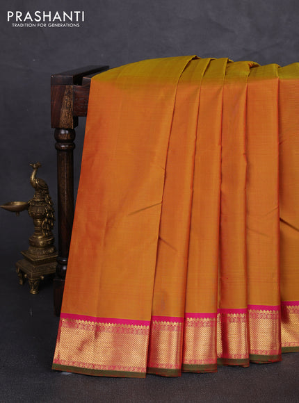 Pure kanchipuram silk saree mustard yellow and pink with plain body and zari woven border