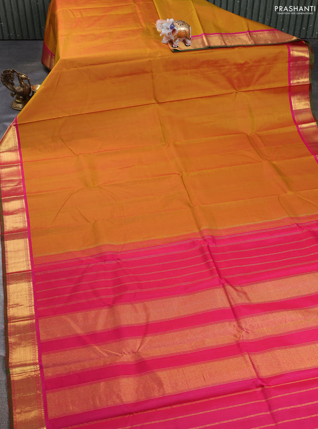 Pure kanchipuram silk saree mustard yellow and pink with plain body and zari woven border