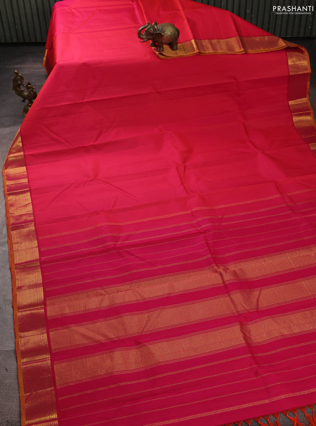 Pure kanchipuram silk saree dual shade of pinkish orange and mustard yellow with plain body and temple zari woven border