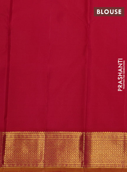 Pure kanchipuram silk saree dual shade of pinkish orange and mustard yellow with plain body and temple zari woven border