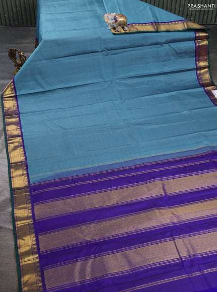Pure kanchipuram silk saree bluish grey and blue with plain body and temple zari woven border