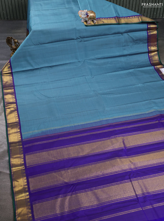 Pure kanchipuram silk saree bluish grey and blue with plain body and temple zari woven border