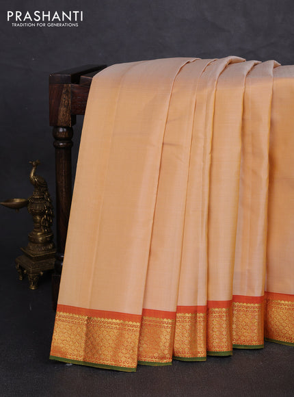 Pure kanchipuram silk saree pale yellow and orange with plain body and zari woven border