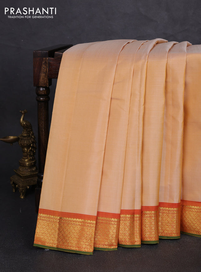 Pure kanchipuram silk saree pale yellow and orange with plain body and zari woven border