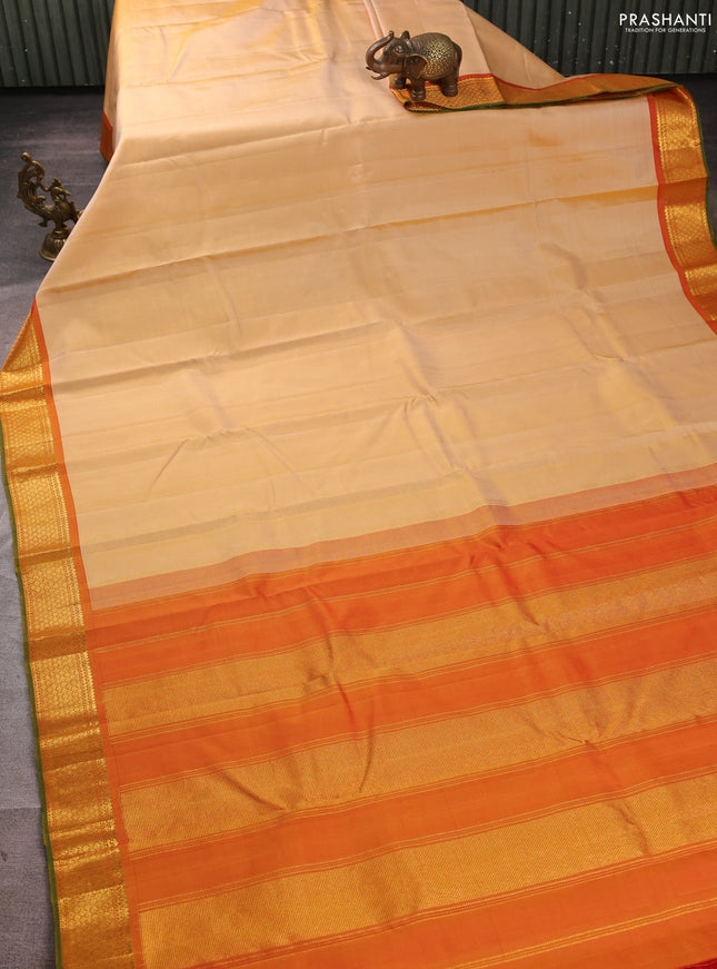 Pure kanchipuram silk saree pale yellow and orange with plain body and zari woven border