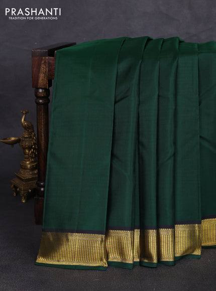 Pure kanchipuram silk saree bottle green with plain body and zari woven border