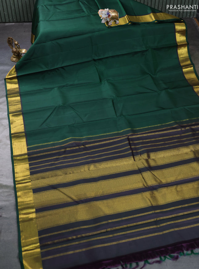 Pure kanchipuram silk saree bottle green with plain body and zari woven border