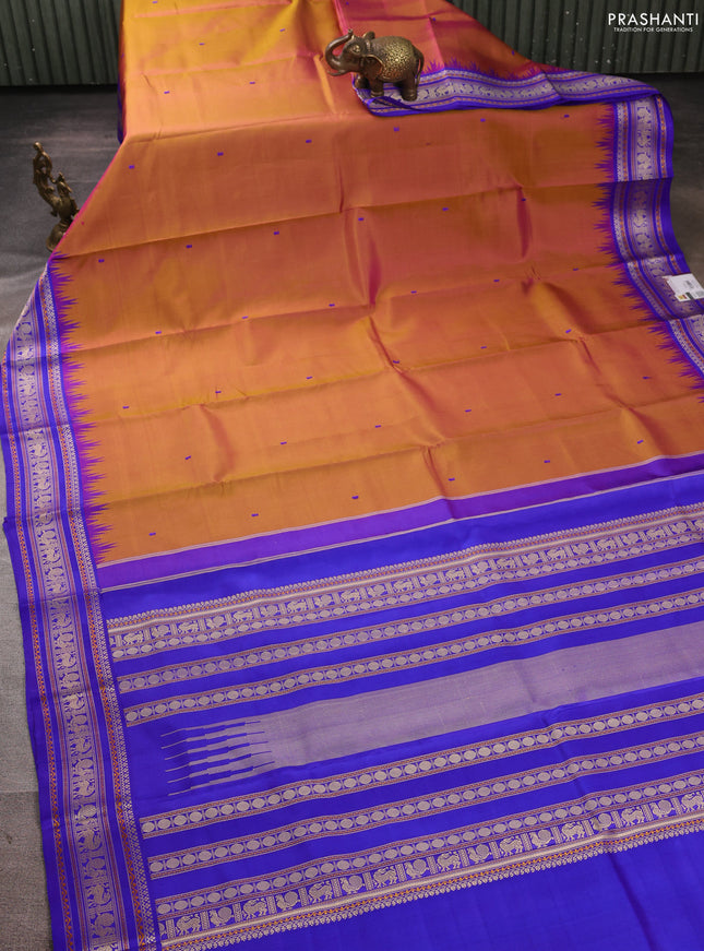 Pure kanchipuram silk saree dual shade of rust shade and royal blue with thread woven buttas and temple design thread woven border