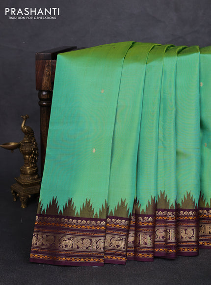 Pure kanchipuram silk saree teal green and wine shade with zari woven buttas and temple design zari woven border