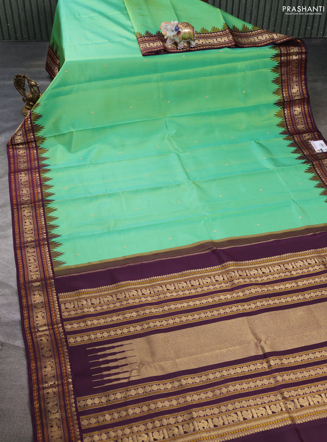 Pure kanchipuram silk saree teal green and wine shade with zari woven buttas and temple design zari woven border