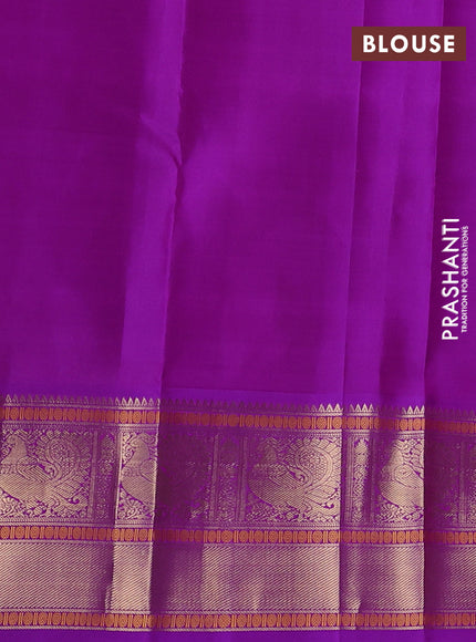Pure kanchipuram silk saree bottle green and purple with zari woven buttas and temple design zari woven border