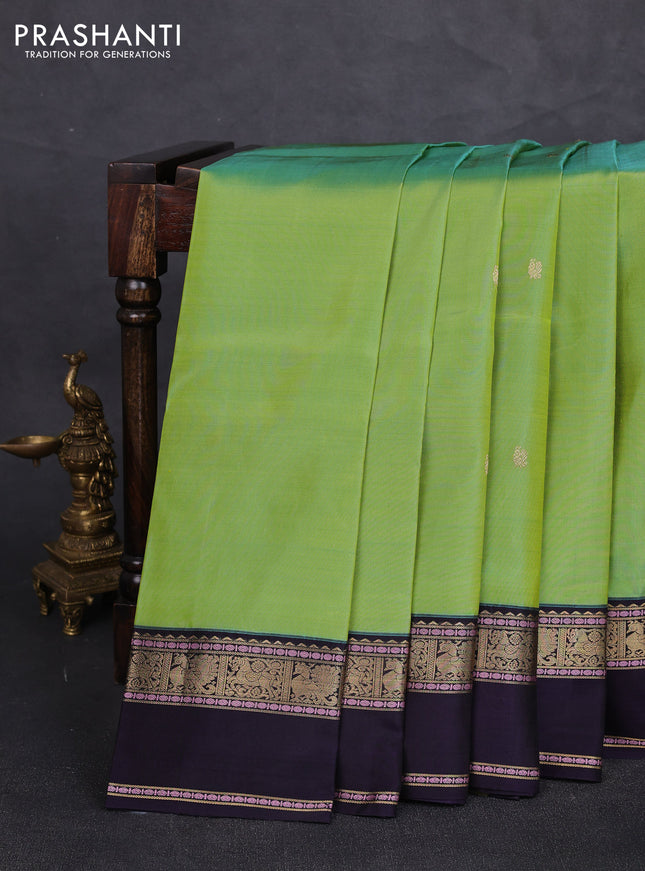 Pure kanchipuram silk saree dual shade of loght green and deep violet with annam zari woven buttas and rettapet zari woven border