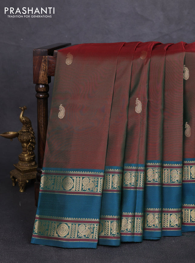 Pure kanchipuram silk saree dual shade of maroon and peacock green with paisley zari woven buttas and rettapet zari woven border